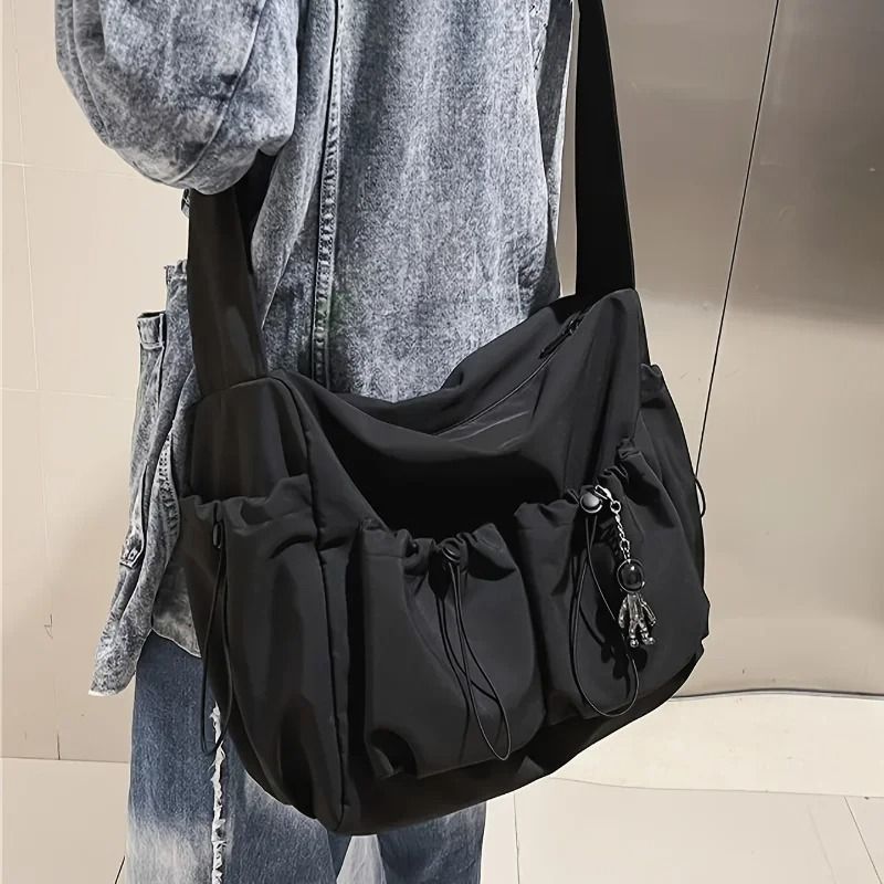 Fashionable Crossbody Bag with Drawstring Accent Spacious Secure Zipper Closure with Stylish Charm