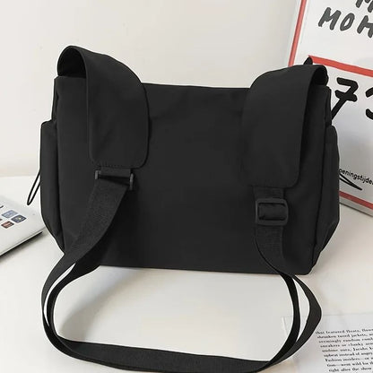 Fashionable Crossbody Bag With Drawstring Accent Spacious Secure Zipper Closure With Stylish Charm 3