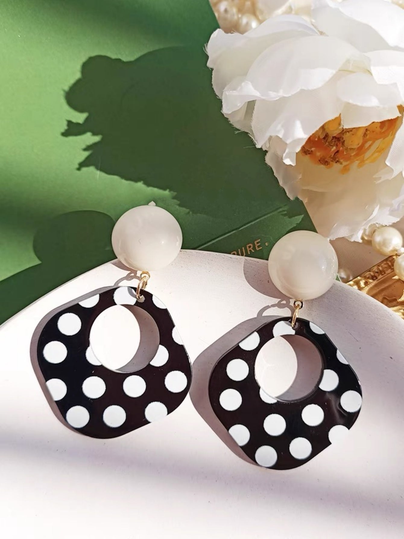 A Pair of Black and White large Polka Dot Hollow Geometric Shape Nostalgia Harbor Wind Earrings