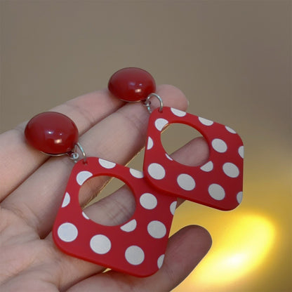 A Pair of Black and White large Polka Dot Hollow Geometric Shape Nostalgia Harbor Wind Earrings