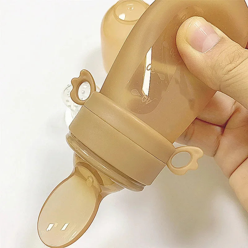 Newborn Baby Training Rice Squeezing Feeding Bottle Silicone Safe Useful Tableware Cereal Food Spoo 1