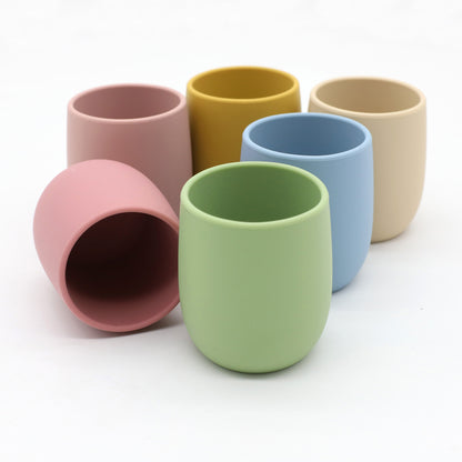 Mini baby silicone water cup, easy-to-grip training cup, safe soft silicone, BPA-free, toddler open sip design.