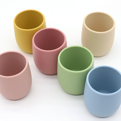 Mini baby silicone water cup, easy-to-grip training cup, safe soft silicone, BPA-free, toddler open sip design.
